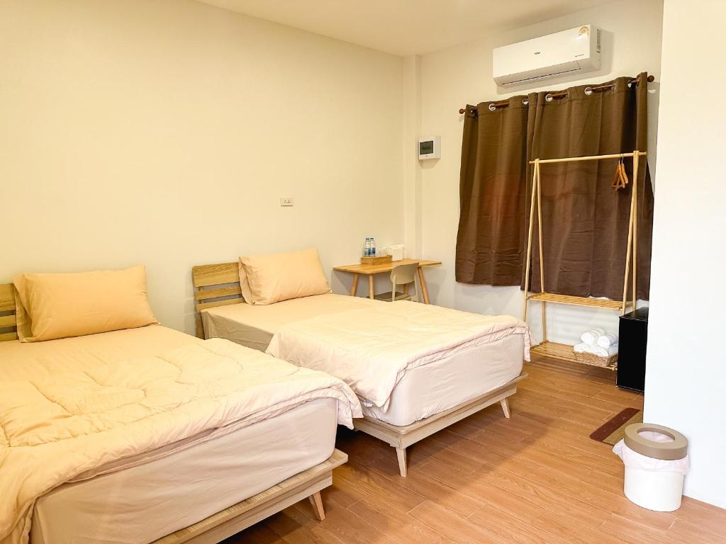 Postel nebo postele na pokoji v ubytování Nakai Resort Sakon Nakhon