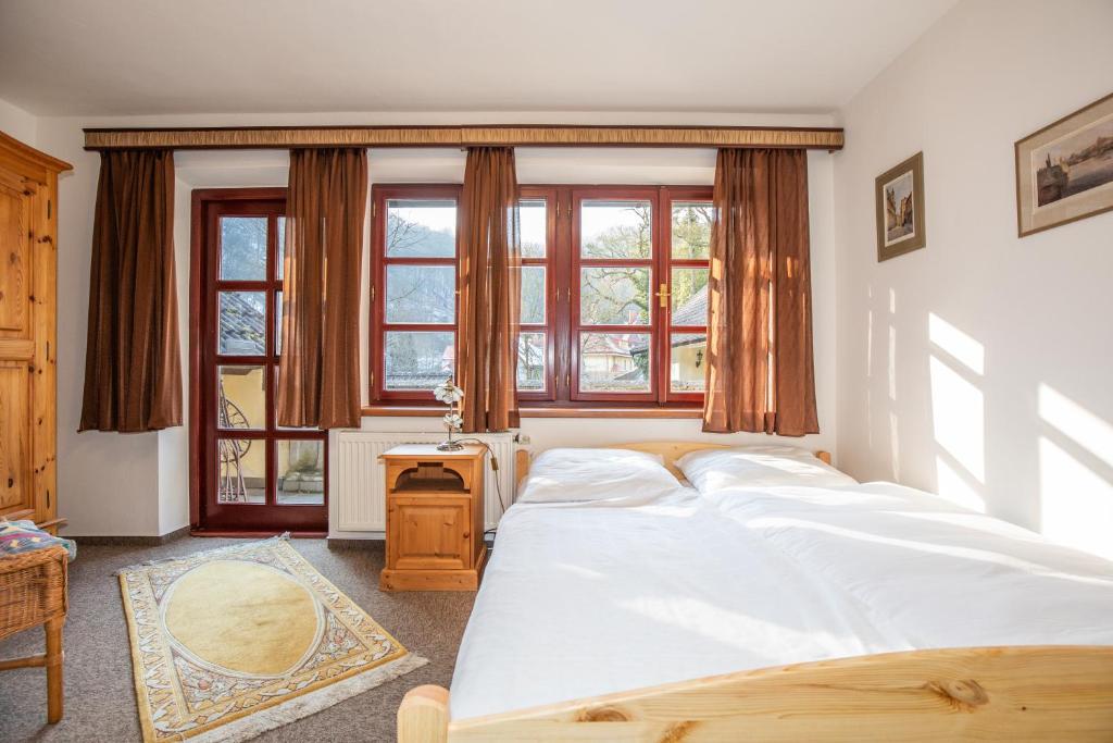 Postel nebo postele na pokoji v ubytování Resort U Jelena