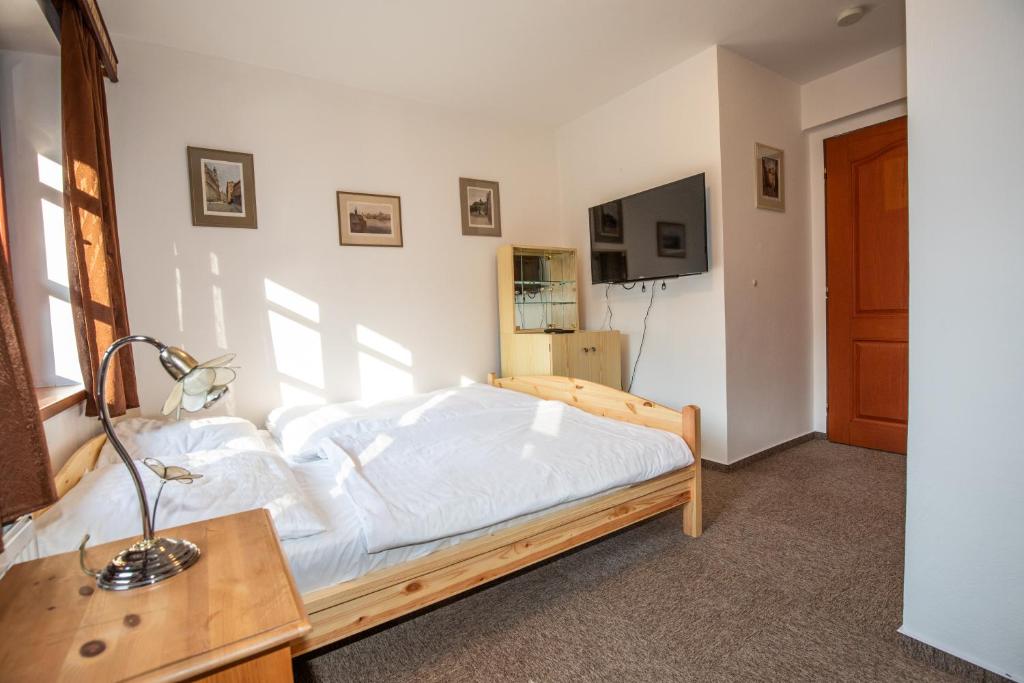 Postel nebo postele na pokoji v ubytování Resort U Jelena