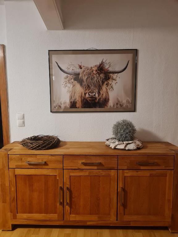 a painting of a bull with horns on a wall at Ferienwohnung mit Burgblick in Mayen