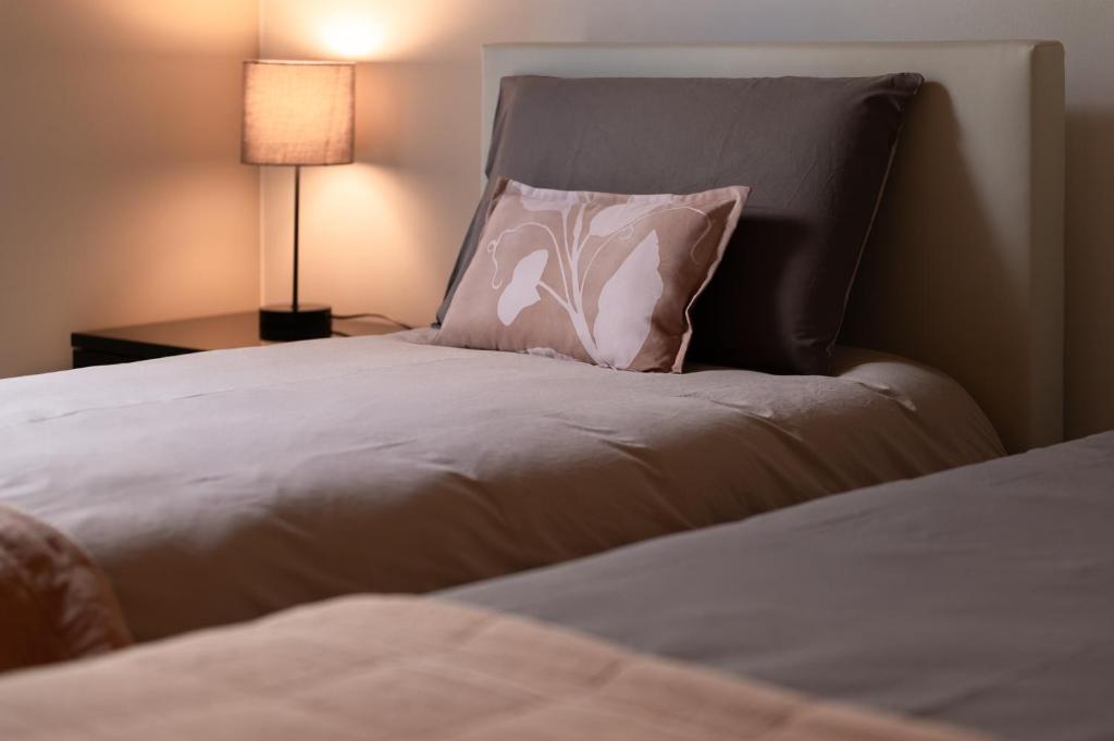 Postel nebo postele na pokoji v ubytování B&B Casa Pralunghi