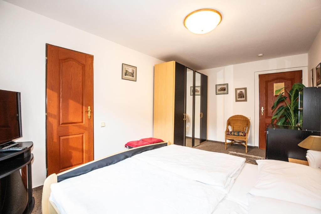Postel nebo postele na pokoji v ubytování Resort U Jelena