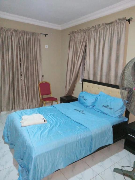 Postel nebo postele na pokoji v ubytování MT4 Hotel
