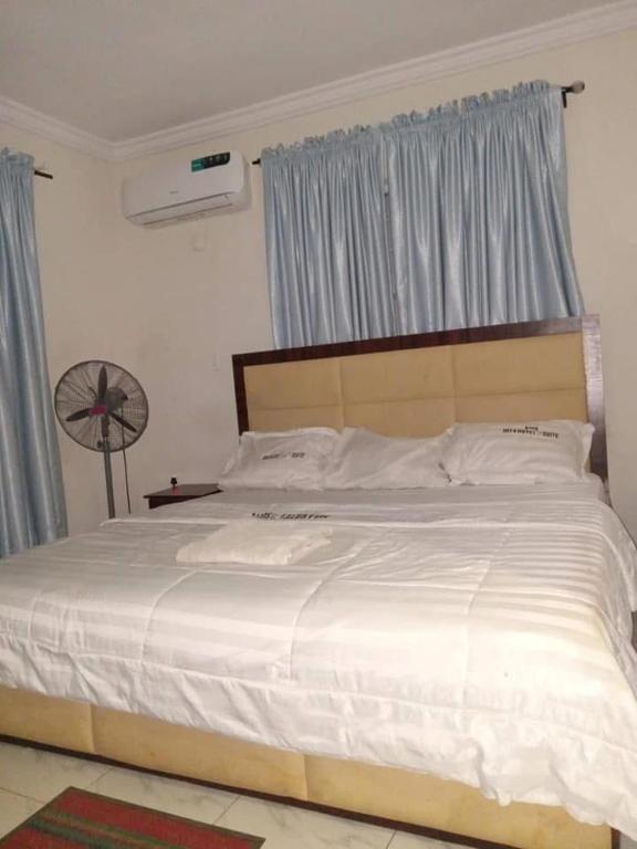Postel nebo postele na pokoji v ubytování MT4 Hotel