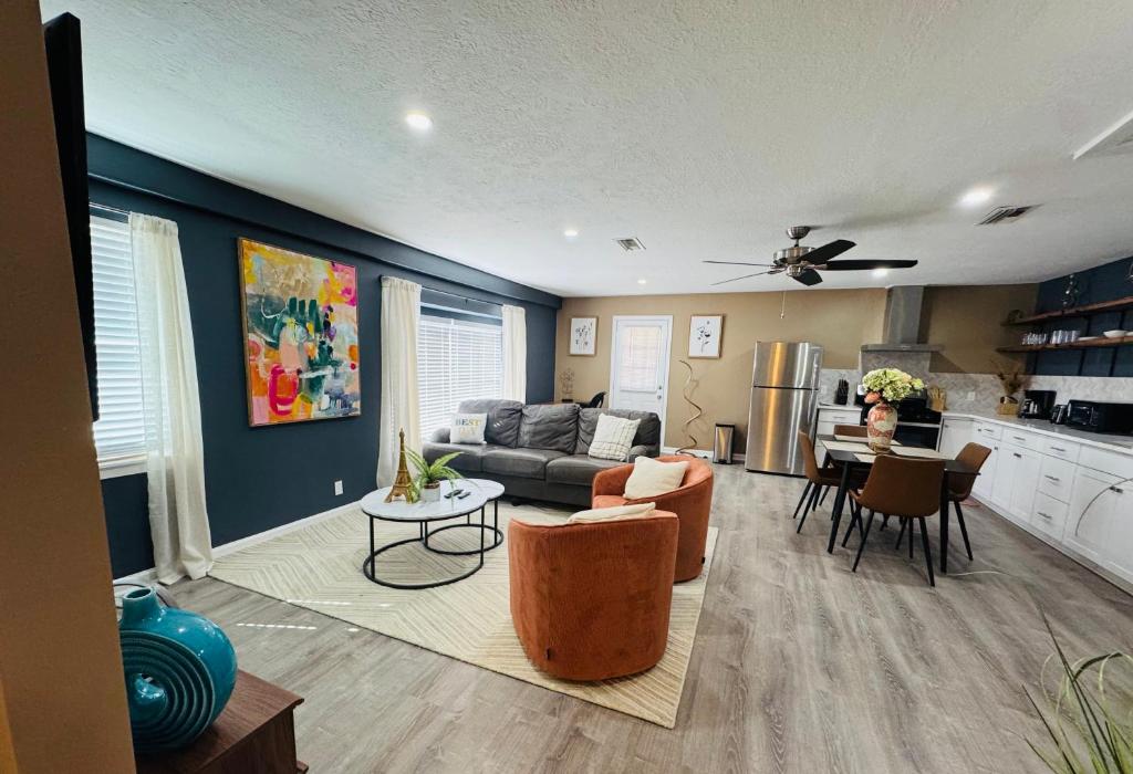 a living room with a couch and a table at Private 2 bedroom duplex in Stafford