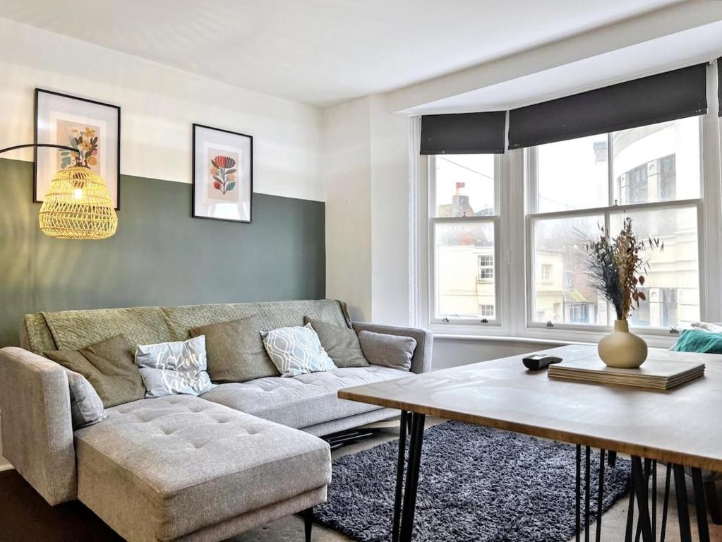 a living room with a couch and a table at The Seaside Snug in Brighton & Hove
