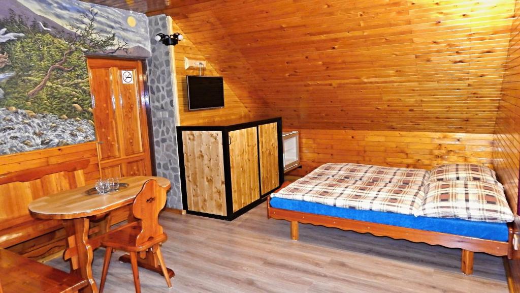 Ένα ή περισσότερα κρεβάτια σε δωμάτιο στο Koliba-Juřena