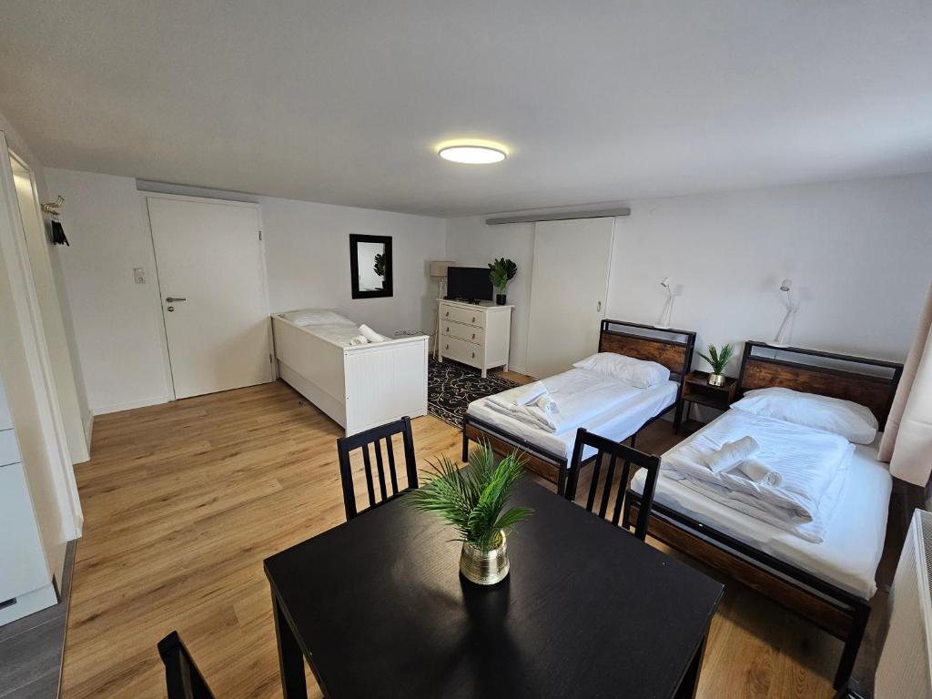 Postel nebo postele na pokoji v ubytování Aparthotel Horn Bahnstrasse