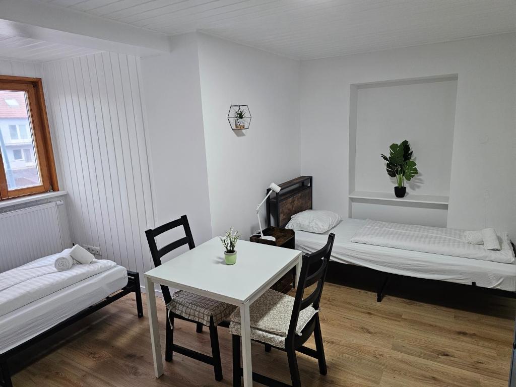Postel nebo postele na pokoji v ubytování Aparthotel Horn Bahnstrasse
