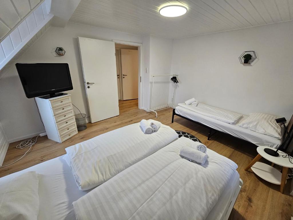 Postel nebo postele na pokoji v ubytování Aparthotel Horn Bahnstrasse