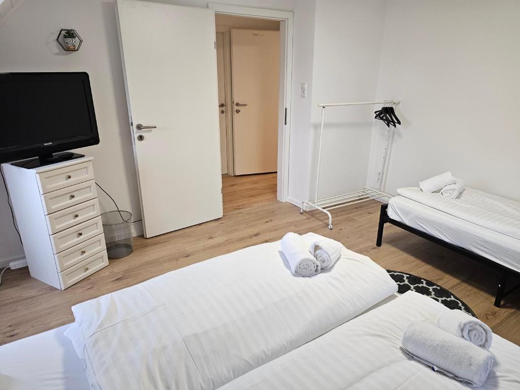 Postel nebo postele na pokoji v ubytování Aparthotel Horn Bahnstrasse
