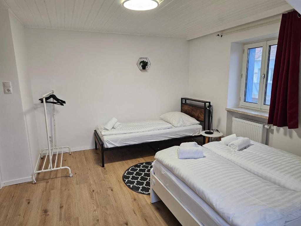 Postel nebo postele na pokoji v ubytování Aparthotel Horn Bahnstrasse