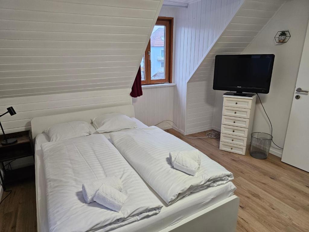 Postel nebo postele na pokoji v ubytování Aparthotel Horn Bahnstrasse
