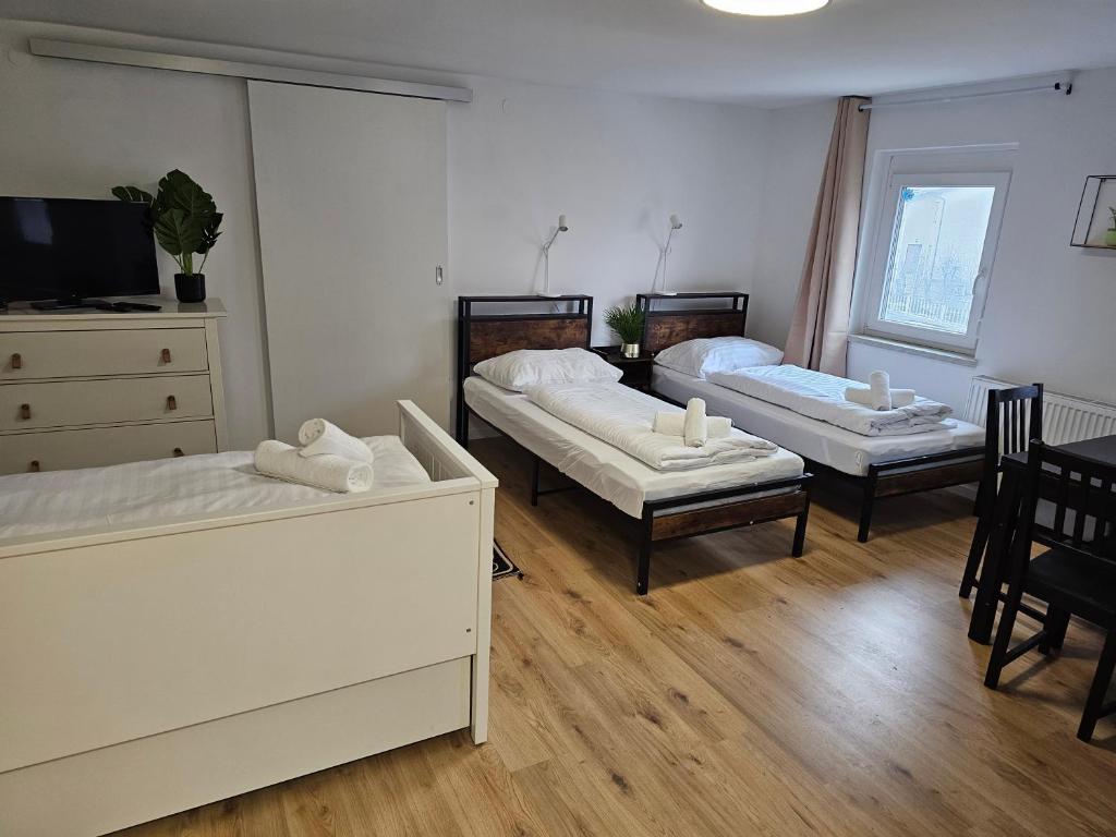 Postel nebo postele na pokoji v ubytování Aparthotel Horn Bahnstrasse