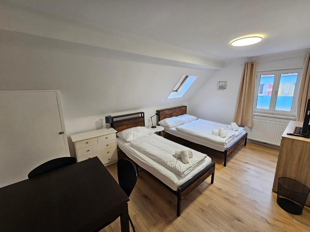 Postel nebo postele na pokoji v ubytování Aparthotel Horn Bahnstrasse