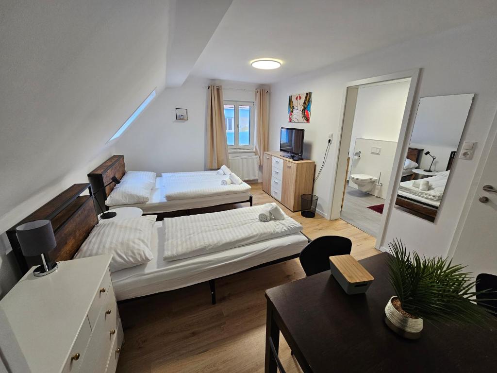 Postel nebo postele na pokoji v ubytování Aparthotel Horn Bahnstrasse