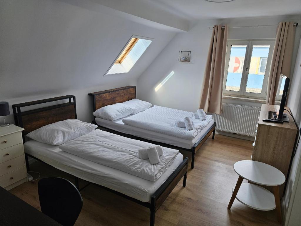Postel nebo postele na pokoji v ubytování Aparthotel Horn Bahnstrasse