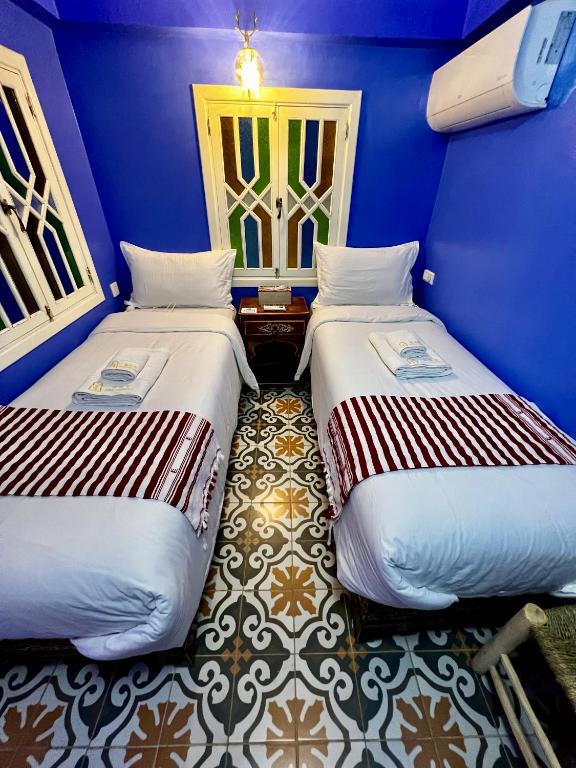 Un ou plusieurs lits dans un hébergement de l'établissement RIAD CHENGLI 蓝城里