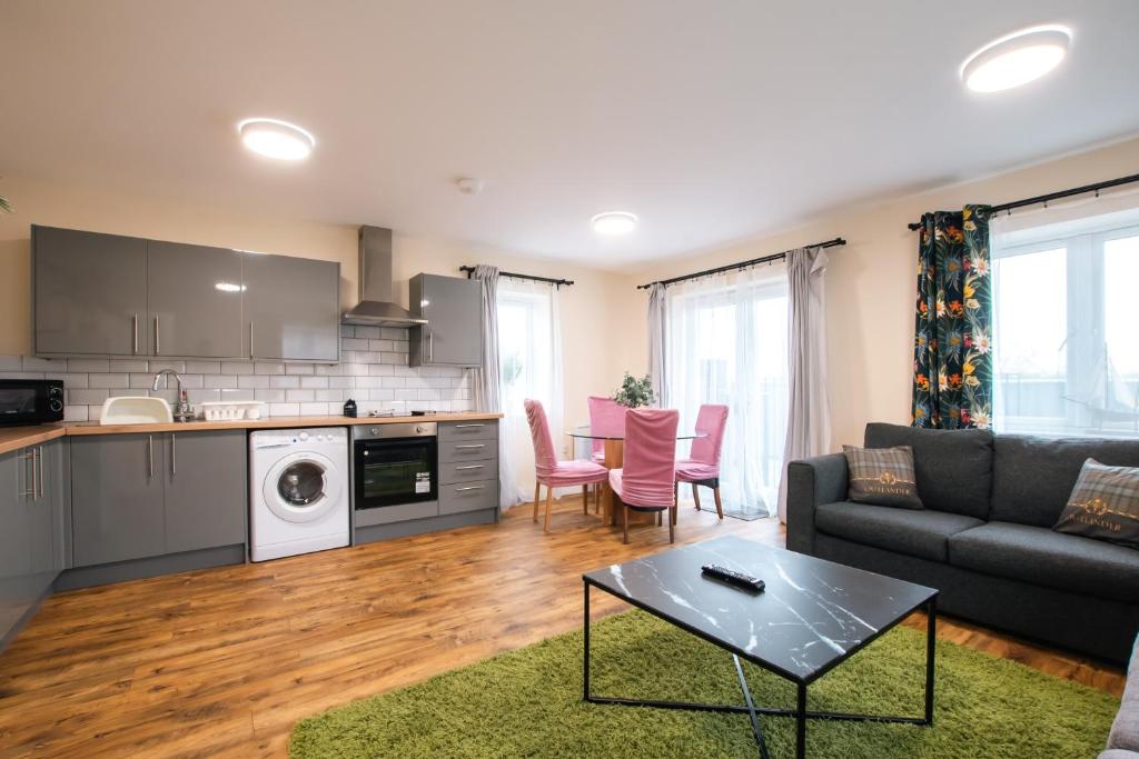 a living room with a couch and a table at Apartment with free P for Van. in Southampton