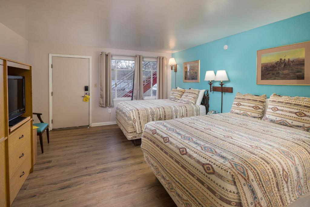 Postel nebo postele na pokoji v ubytování Apache Motel