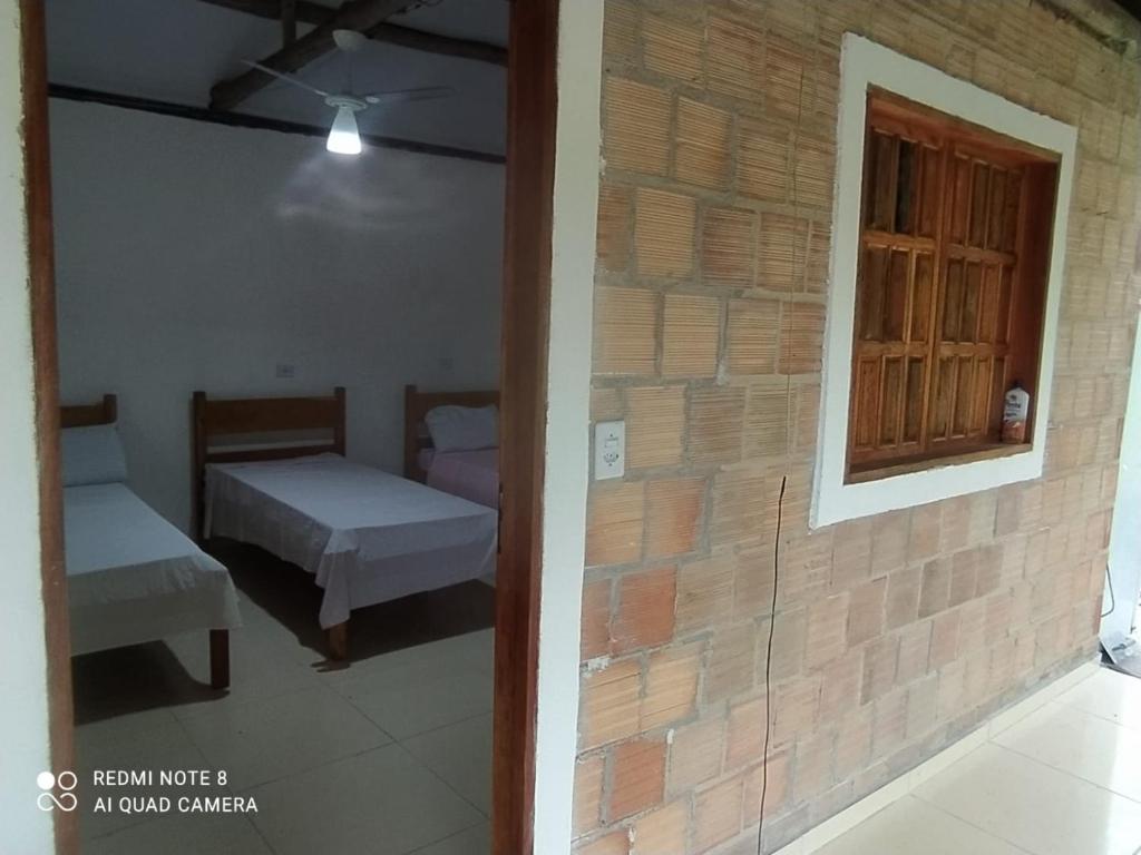 Postel nebo postele na pokoji v ubytování Hospedaria Caribe