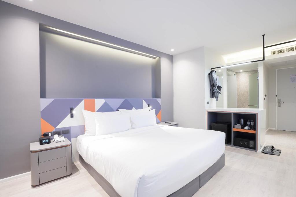 Postel nebo postele na pokoji v ubytování Maybis Hotel