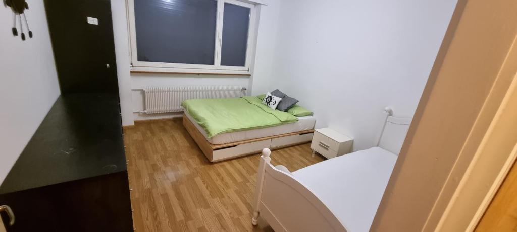 Postel nebo postele na pokoji v ubytování Basel