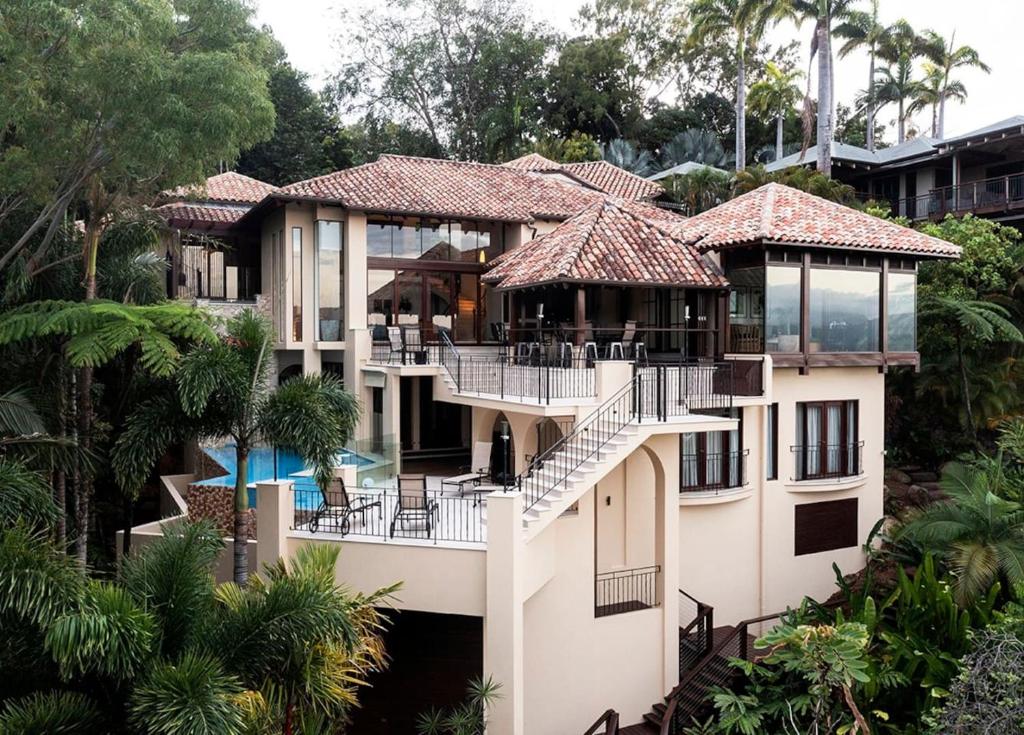 an aerial view of a house with a pool at Villa Aman - Tropical Luxury with Infinity Pool in Port Douglas
