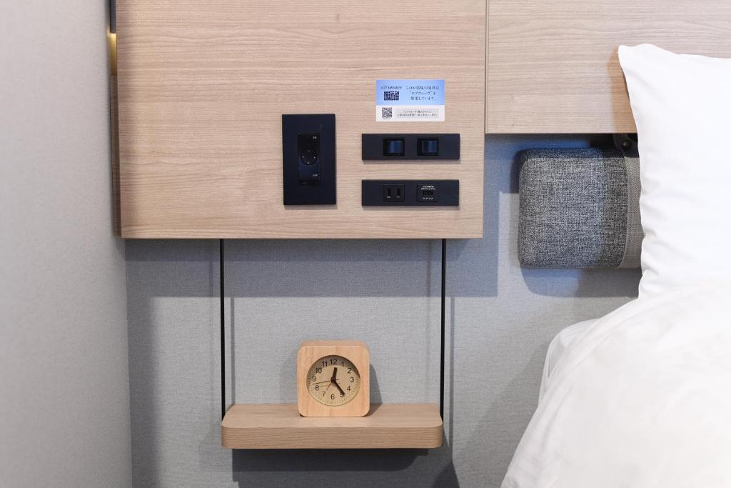 Postel nebo postele na pokoji v ubytování Washington R&B Hotel Kyoto Station Hachijoguchi