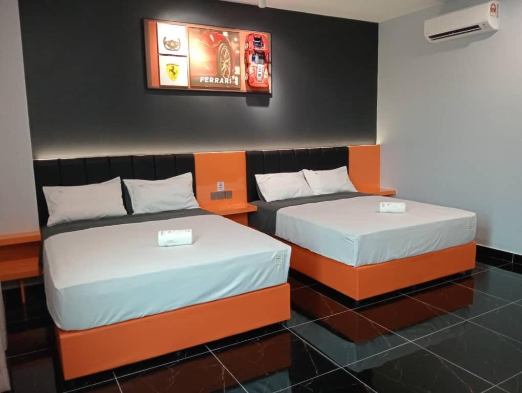 Postel nebo postele na pokoji v ubytování Eng Wan Hotel