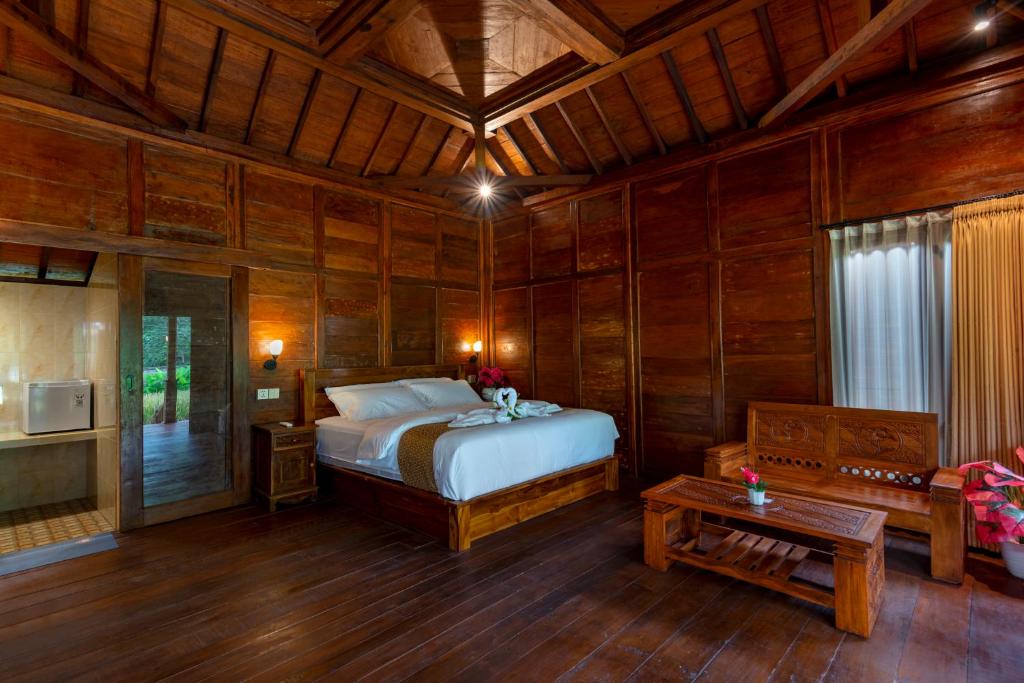 Postel nebo postele na pokoji v ubytování Uma Ulun Dugul Ubud by Uniquecations