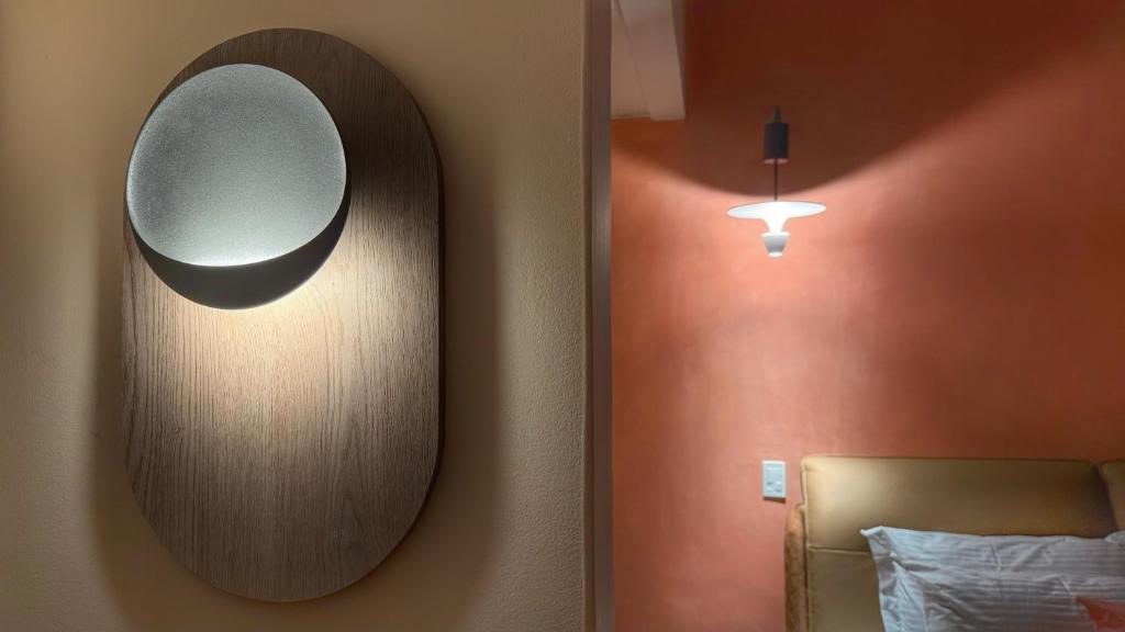 Postel nebo postele na pokoji v ubytování Autenthico Provenza Hotel Medellin