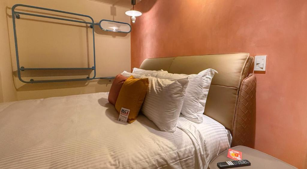 Postel nebo postele na pokoji v ubytování Autenthico Provenza Hotel Medellin