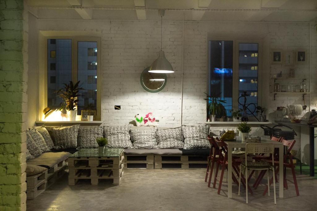 a living room with a couch and a table at Bla Bla Hostel in Krasnodar