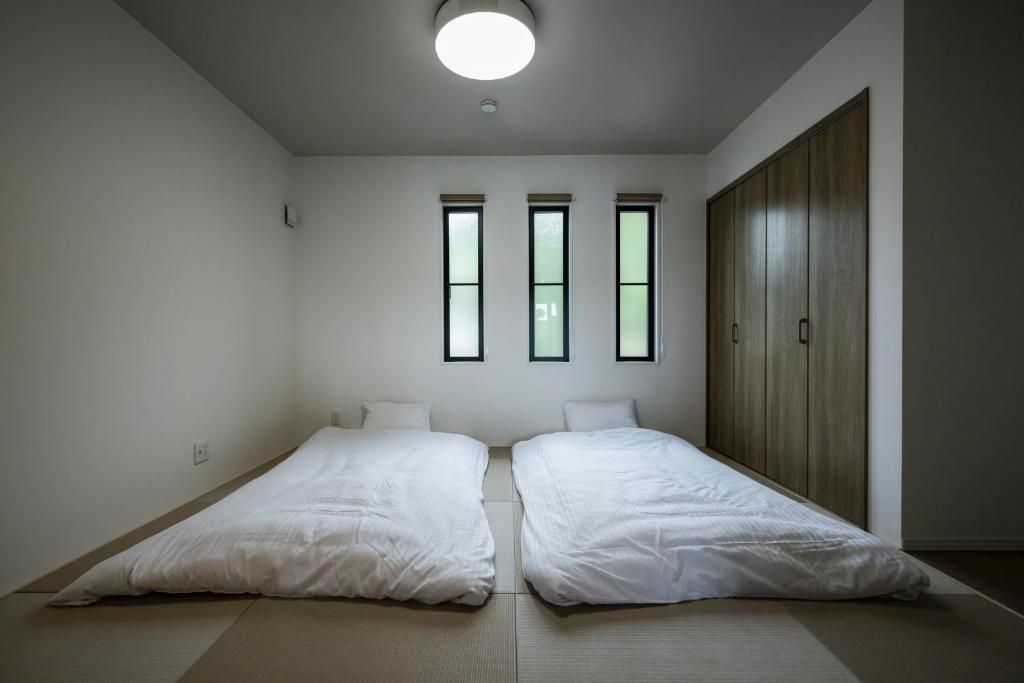 Postel nebo postele na pokoji v ubytování Seaside Villa N Plus