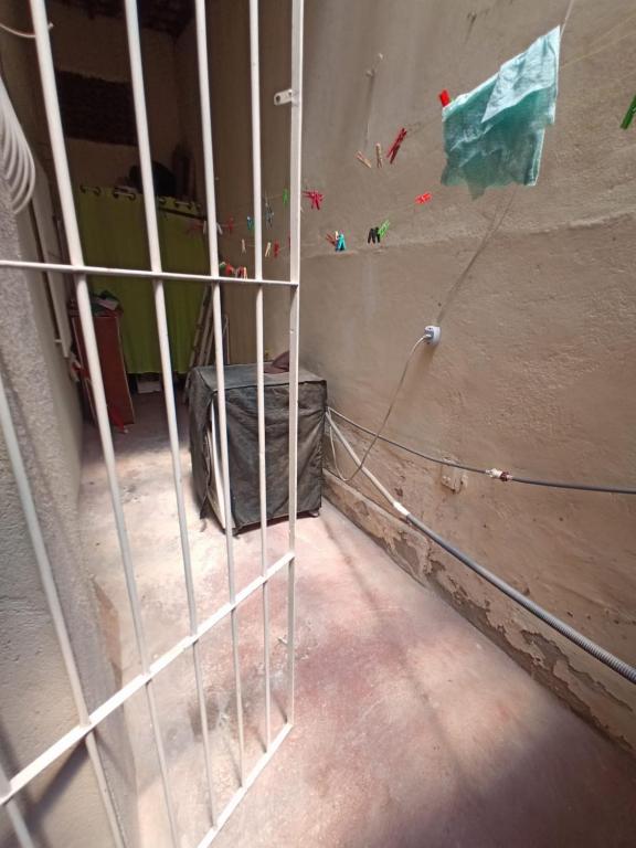 a room with a metal fence in a room at Recanto de Sol e Mar SPA in São Pedro da Aldeia