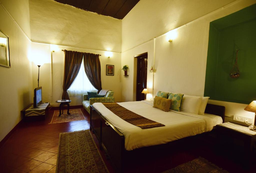 Postel nebo postele na pokoji v ubytování The Lodge, Madikeri