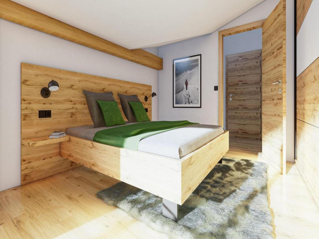 Posteľ alebo postele v izbe v ubytovaní Bergzeit flat Saalbach directly on the ski piste