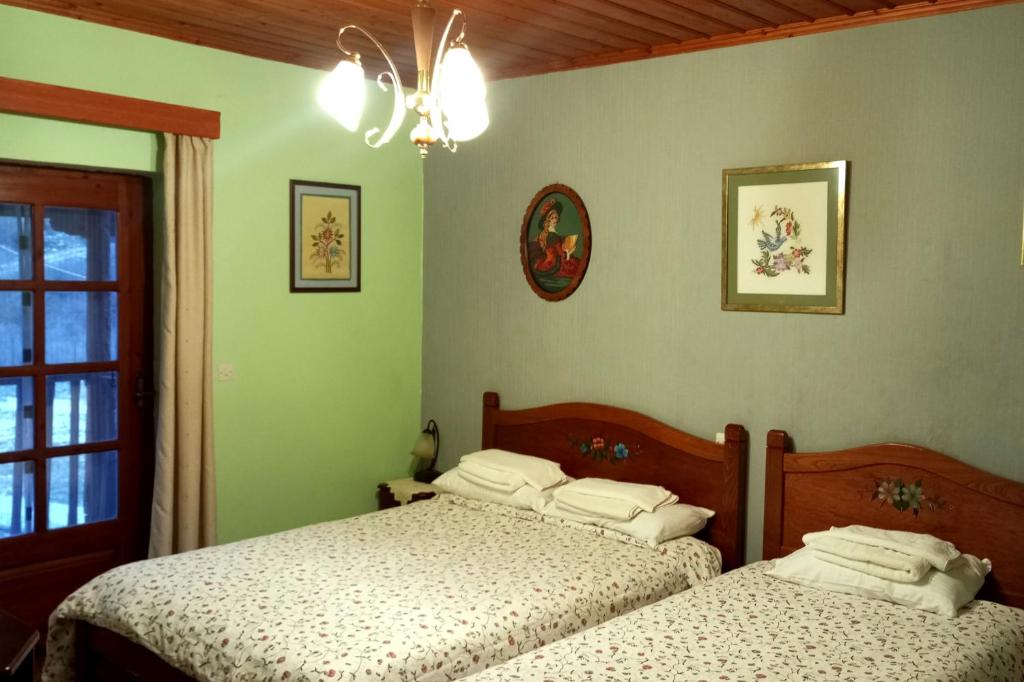 Postel nebo postele na pokoji v ubytování Xenonas Achnoulas