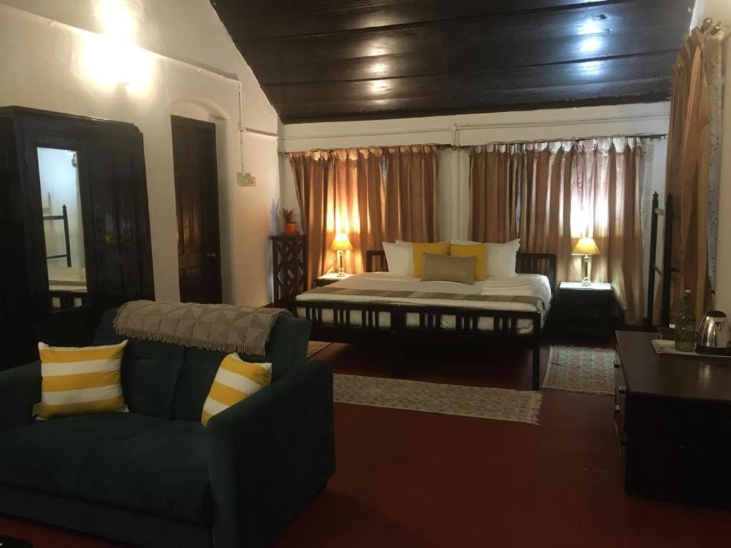 Postel nebo postele na pokoji v ubytování The Lodge, Madikeri