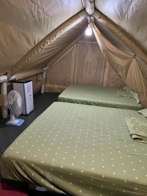 Postel nebo postele na pokoji v ubytování TK Coconut Camping