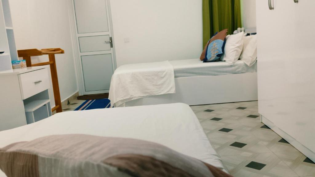 Postel nebo postele na pokoji v ubytování Kadufenna Stay