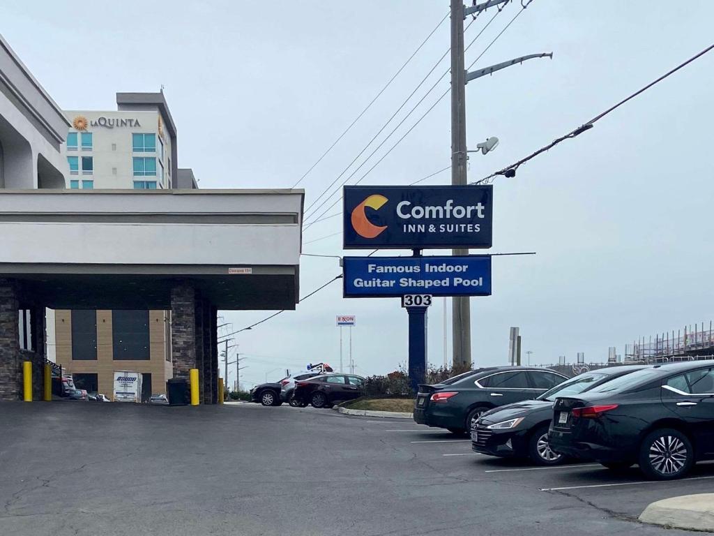 a car dealership with cars parked in a parking lot at Comfort Inn & Suites Nashville Downtown - Stadium in Nashville