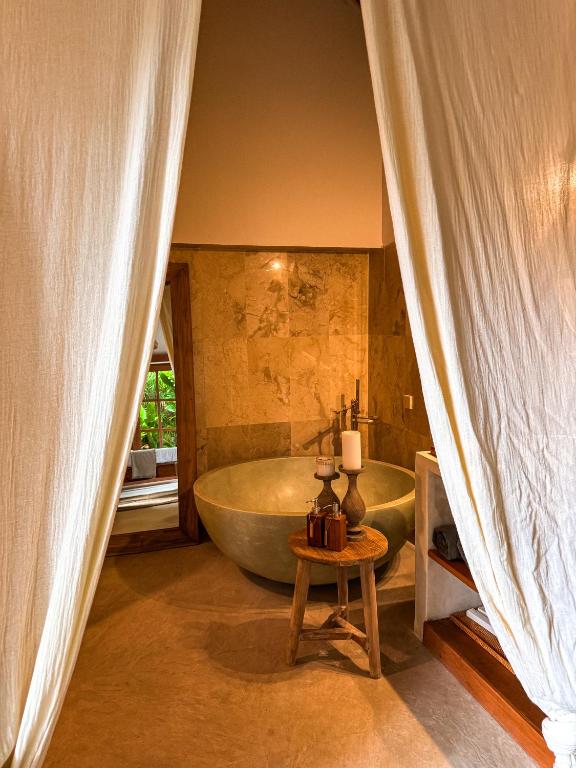 Postel nebo postele na pokoji v ubytování Bali Maison