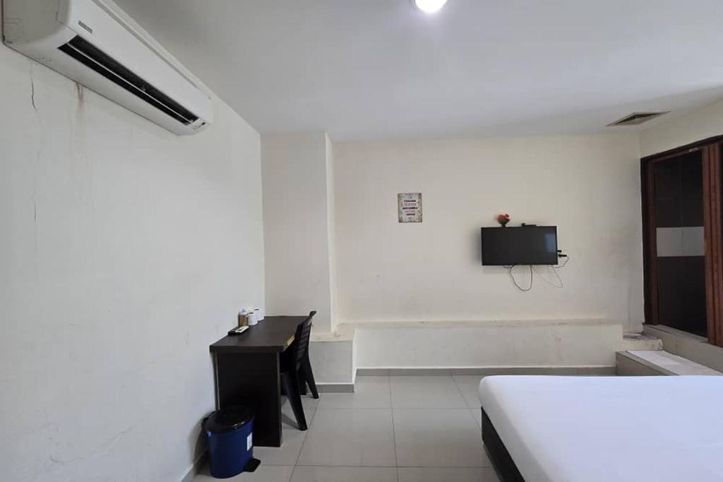 Postel nebo postele na pokoji v ubytování Hotel Inap Sri Gombak