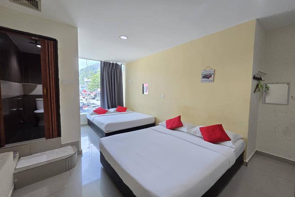 Postel nebo postele na pokoji v ubytování Hotel Inap Sri Gombak