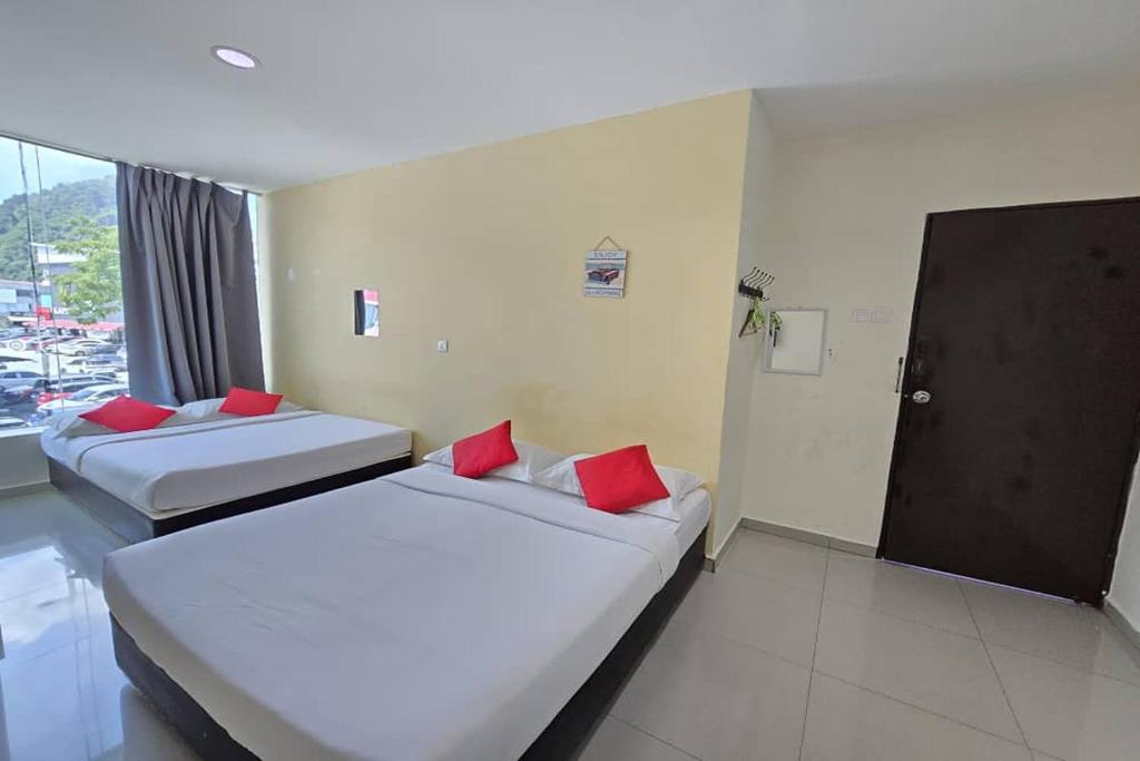 Postel nebo postele na pokoji v ubytování Hotel Inap Sri Gombak
