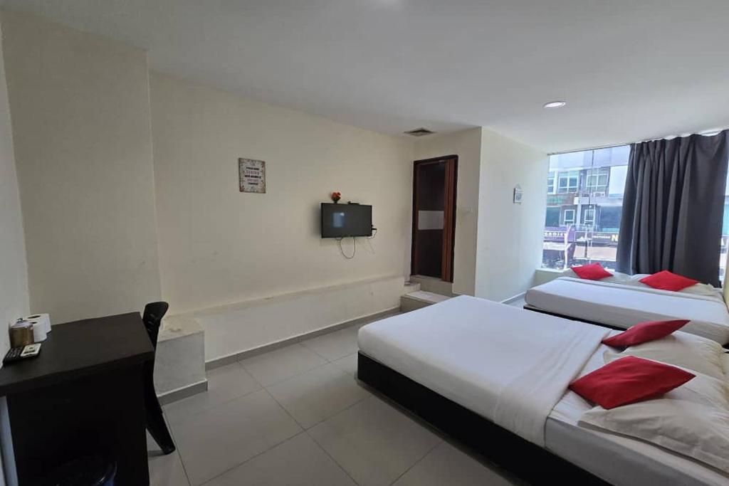 Postel nebo postele na pokoji v ubytování Hotel Inap Sri Gombak