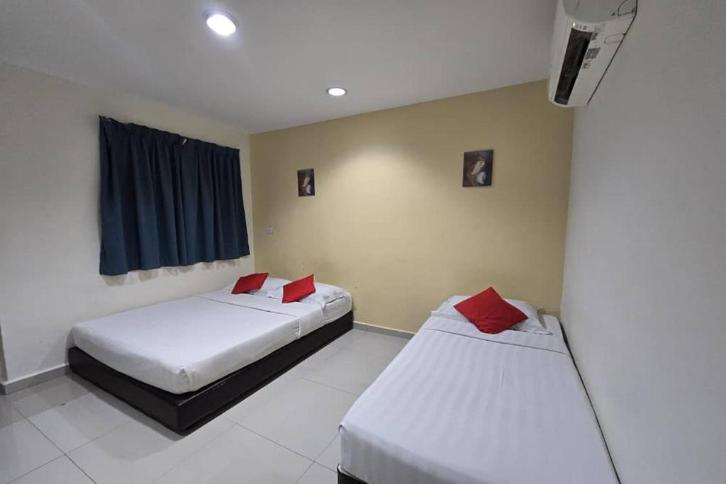 Postel nebo postele na pokoji v ubytování Hotel Inap Sri Gombak