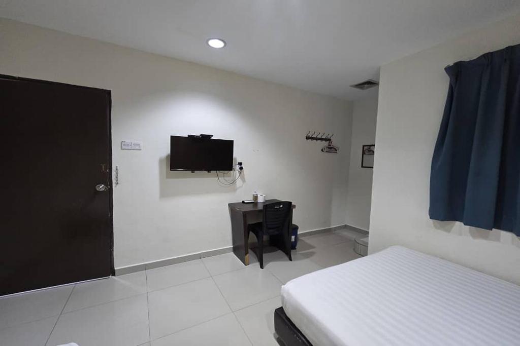 Postel nebo postele na pokoji v ubytování Hotel Inap Sri Gombak